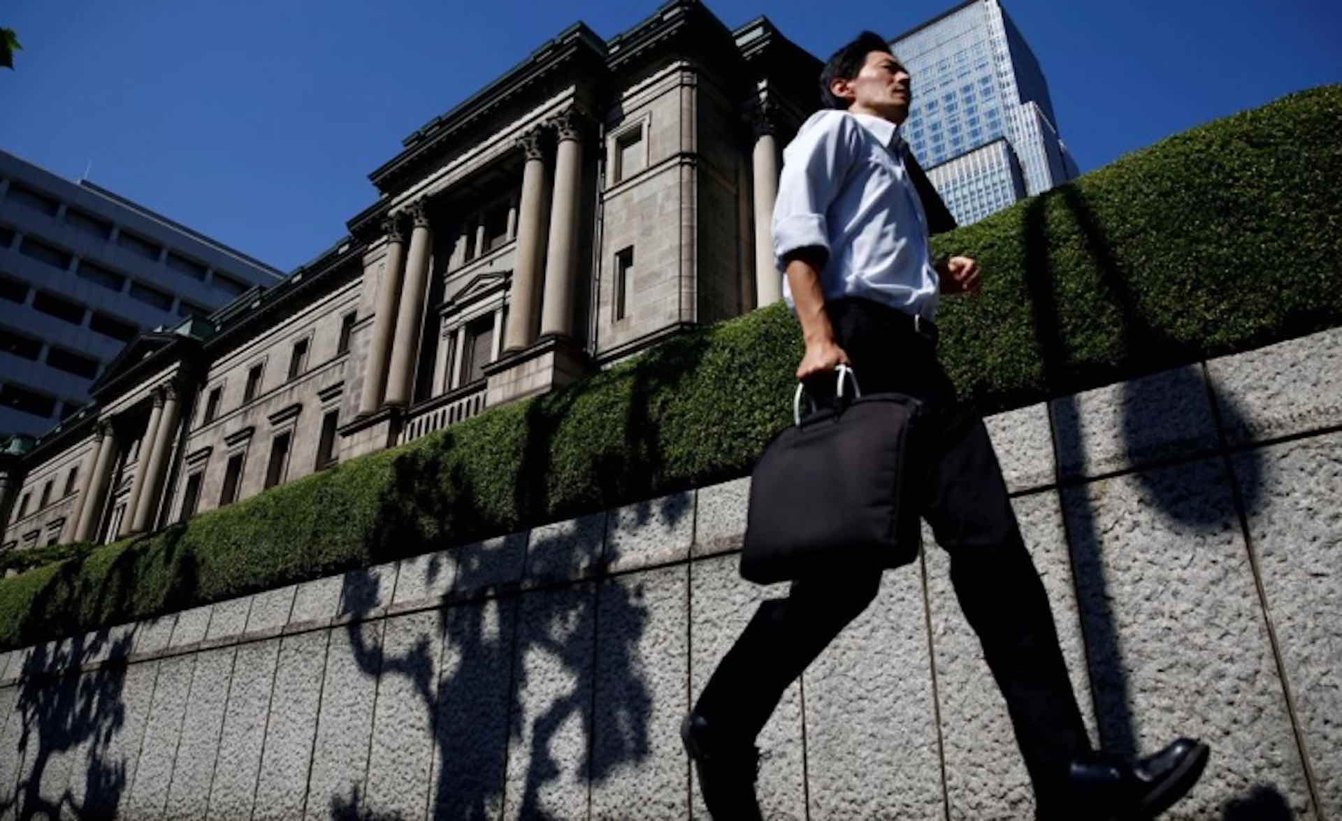 BOJ official commits to keep ultra-low rates, warns of financial risks